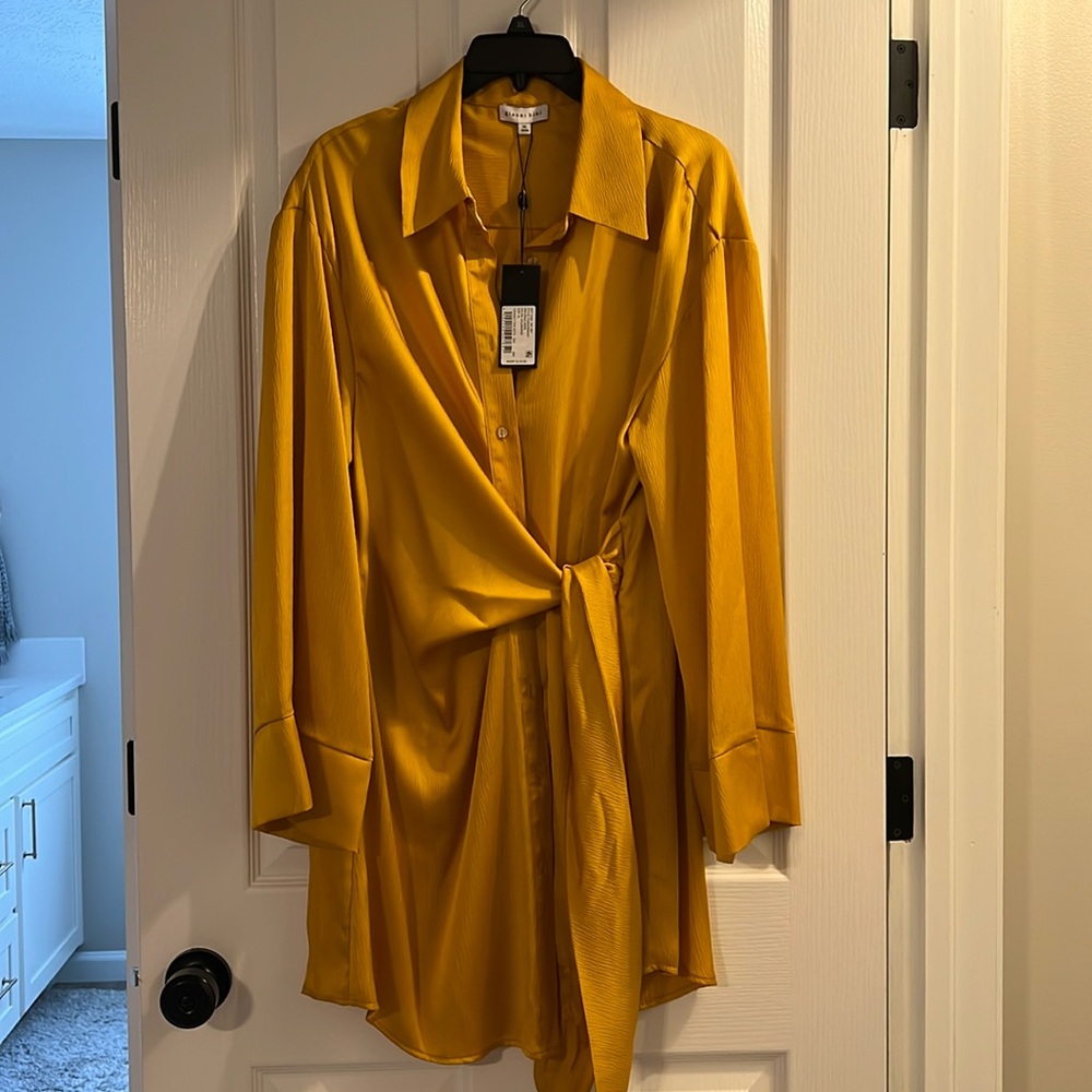 Gianni Bini NWT and never worn. Gold wrap dress.